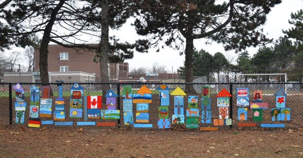 a large number of colourful paintings by students at a junior public school.  Some are scenes of Toronto, others are of animals or plants or buildings.  