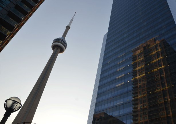 The CN tower between two skyscrapers