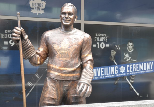 statue of hockey player Syl Apps stands with stick in hand in Legends Row outside the ACC in Toronto