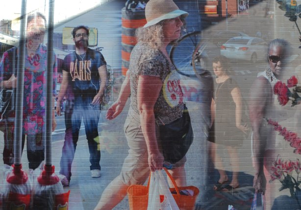 part of a mural in Honest Eds Alley by Matthew Monteith showing people walking past the windows of Honest Ed's store, large scale photo
