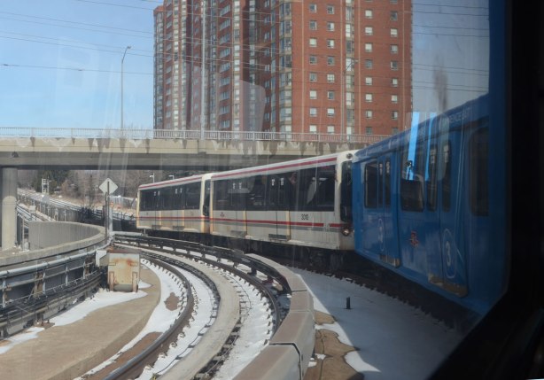 the Scarborough RT train as it leaves Kennedy station, the track curves so you can see the front of the train out the window 
