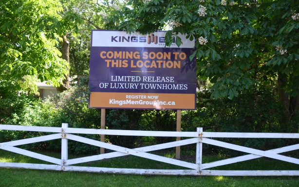 sign advertising new townhouse devlopment by kingsmen Group inc. 