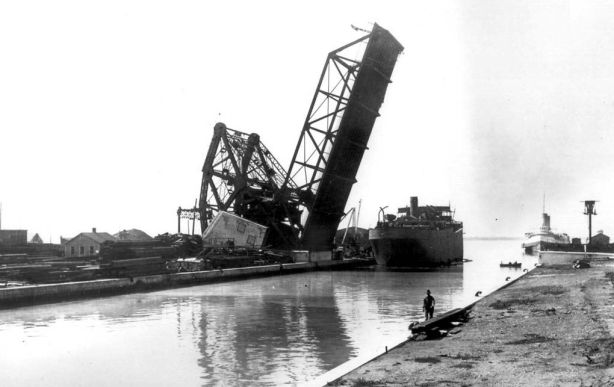 photo from the Toronto Archives of the liftbridge at Cherry Street, open position, black and white photo taken about 1915, found on Wikipedia. 