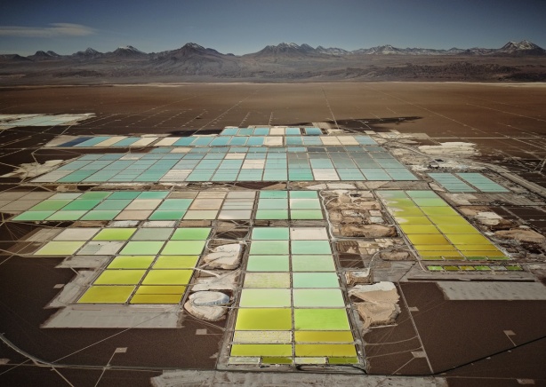 coloured ponds in a lithium mine in Chile, shades of yellows, greens and blues 
