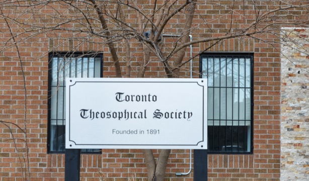 sign outside a brick building says Toronto Theosophical Society 