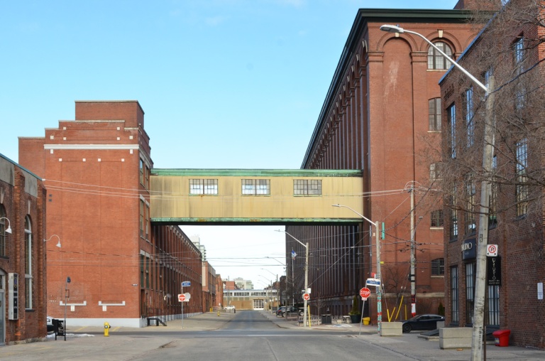old factory buildings in Liberty Village, with a connecting bridge between them that is over the street