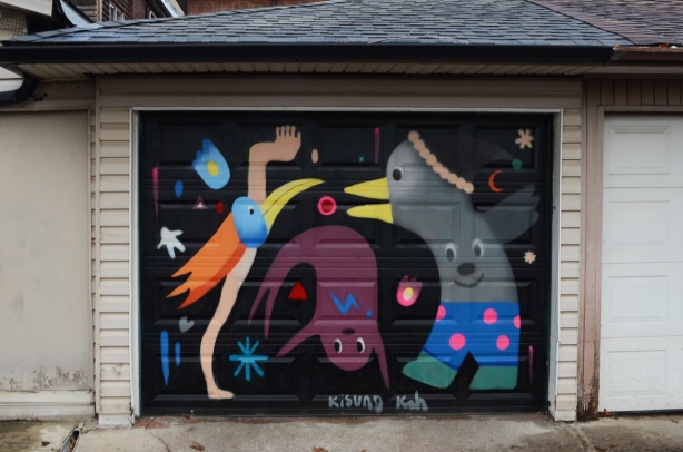 mural by Kisong Koh on the door of a garage in a laneway