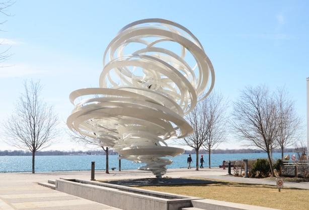 along the waterfront, whirlwind, a metal white sculpture, tornado swirls of metal, by Lake Ontario, 