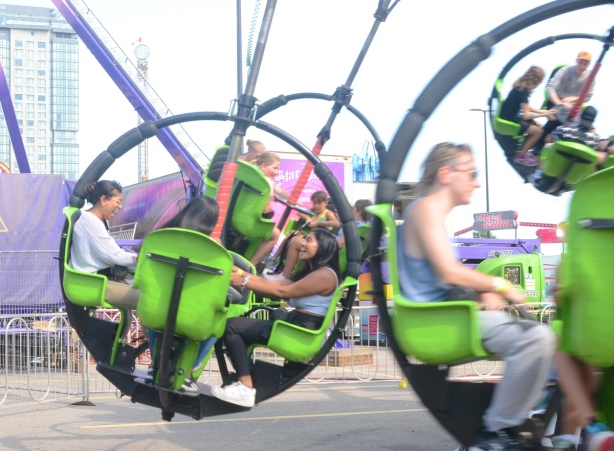 people at the ex, on midway rides