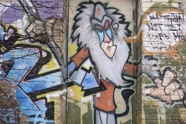 street art on a door, lion with grey man, standing upright, cartoon movie character, 
