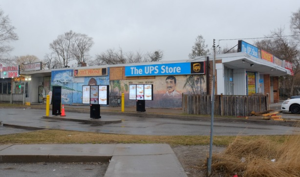 On the side of the UPS store, and beside Tim Hortons drive through, there are two murals on a wall