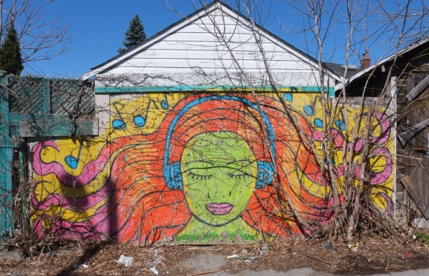 mural of a woman's face, eyes closed