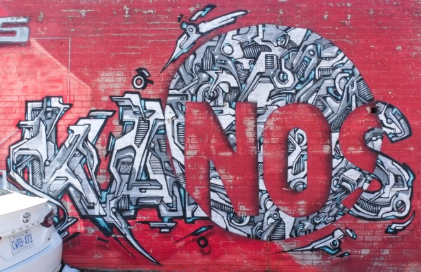 black and white on red mural by kanos
