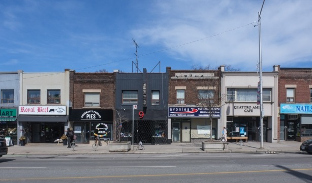row of two story brick stores on danforth