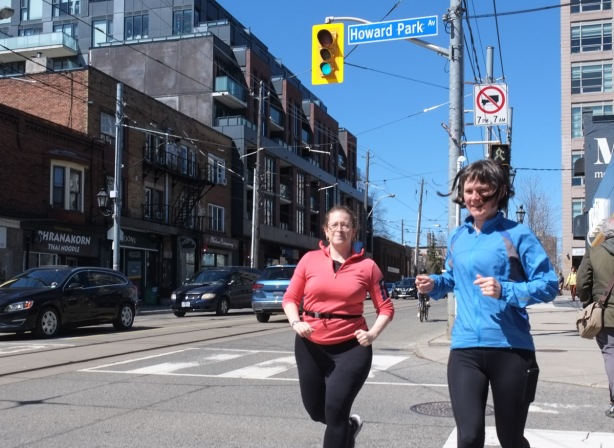 two women jogging on Roncesvalles at Howard Park