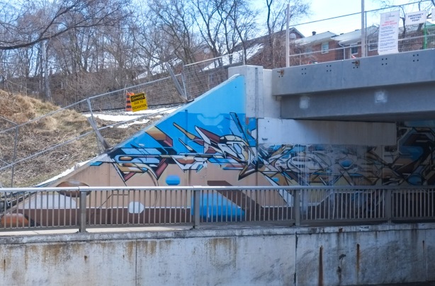 mural by mediah, geometric shapes and colours, on an underpass