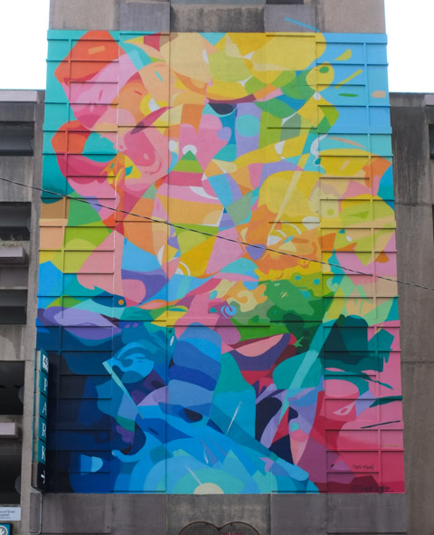 large colourful abstract mural on the side of parking garage behind Mount Sinai Hospital