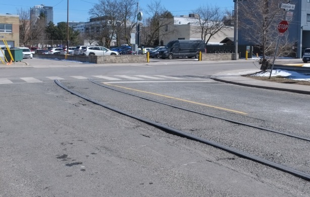 old streetcar tracks in a street, Strathmore Blvd., that come to an end.